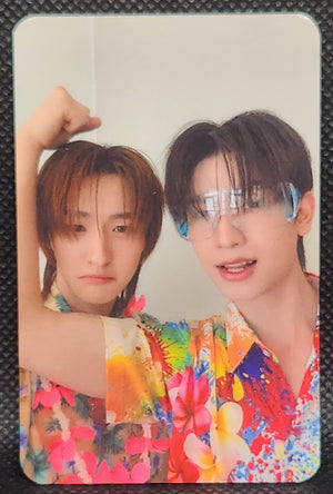 Thomas and Kong posing together in colorful shirts. Thomas is flexing his bicep.